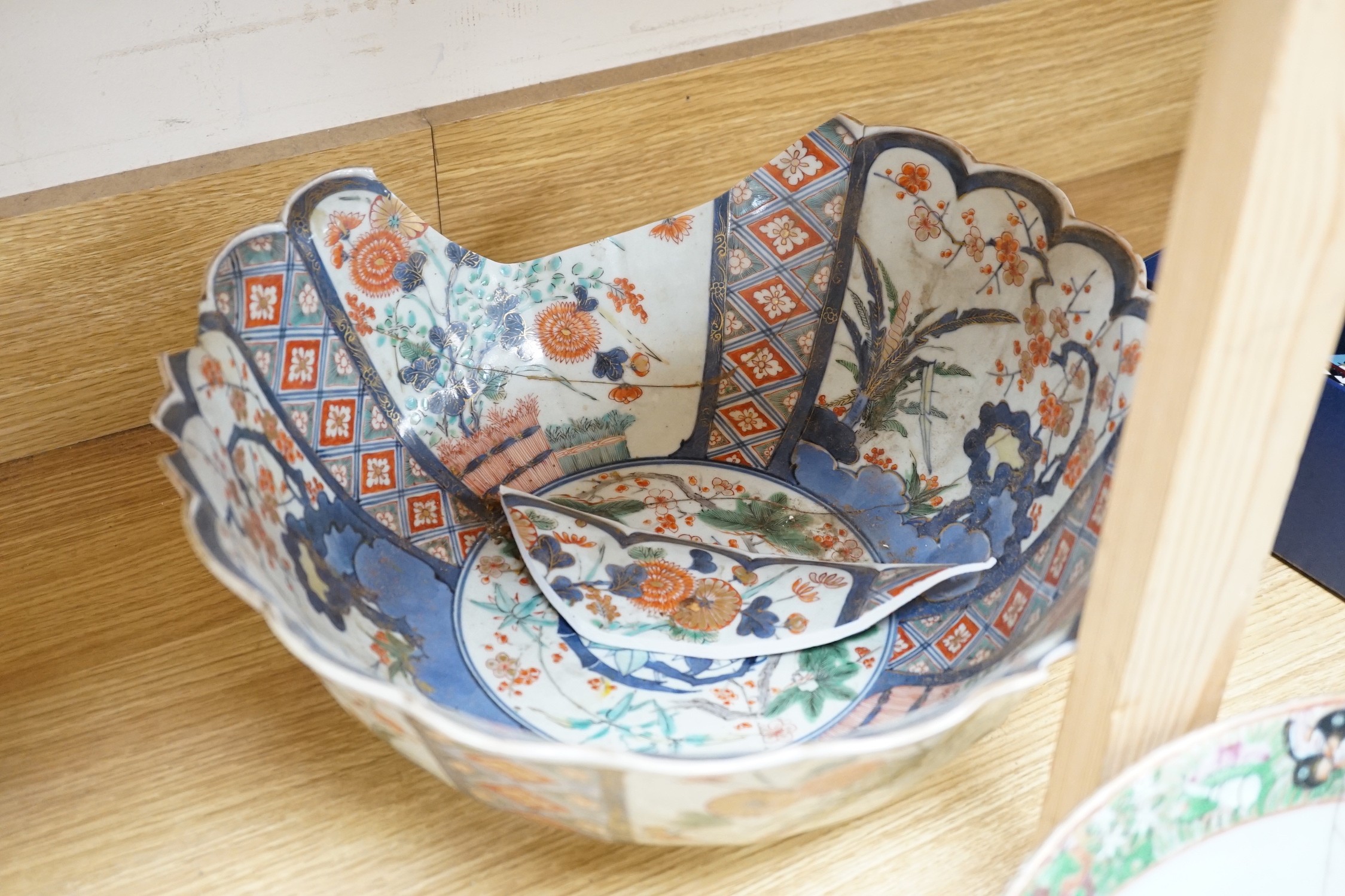 A 19th century Imari bowl, a famille rose bowl and one other- all damaged
